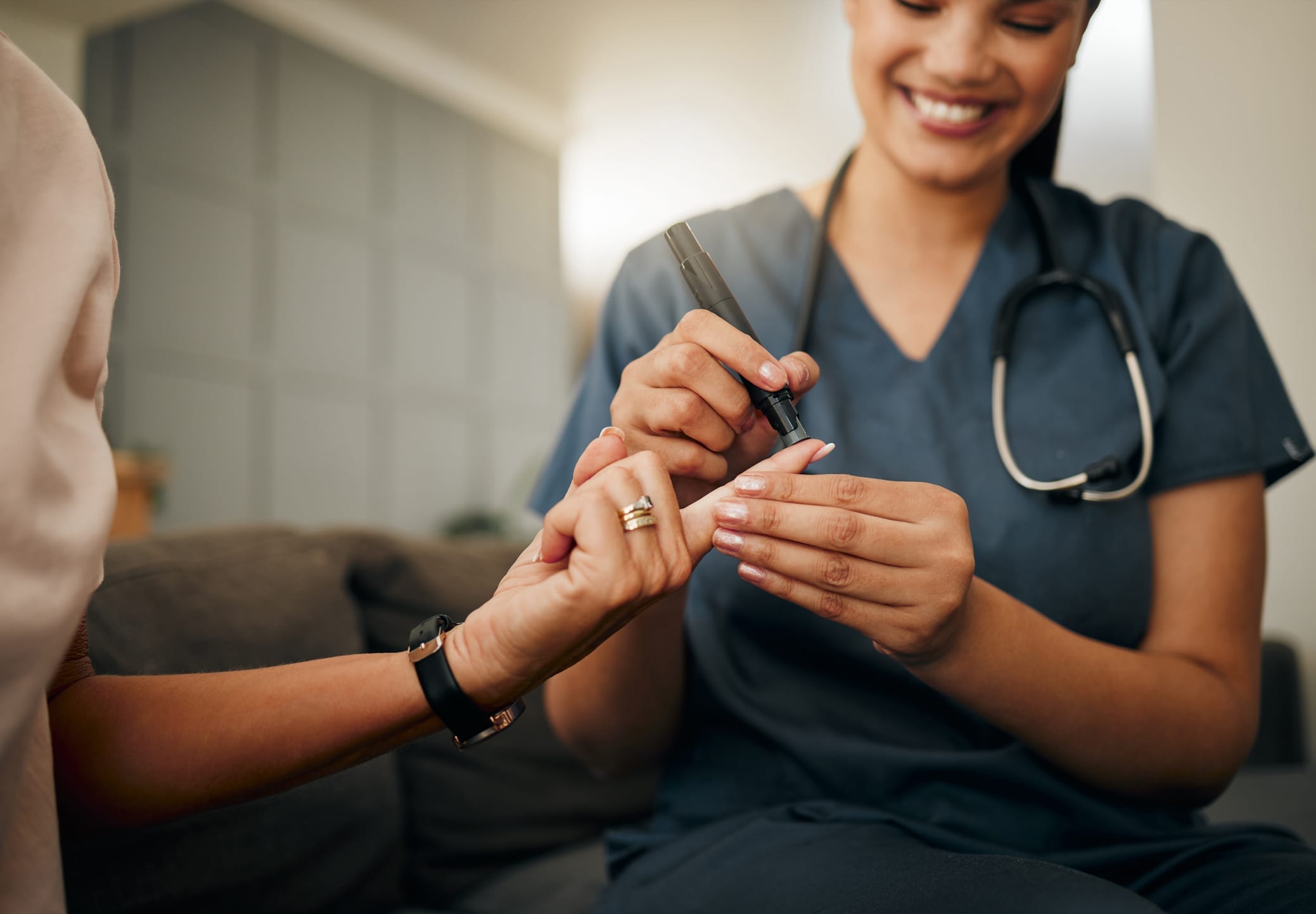 Zoom of doctor, diabetes or elderly woman hands with blood test, sugar or medical test with a glucometer. Healthcare, health nurse or diabetic lady consulting on glucose wellness in living room